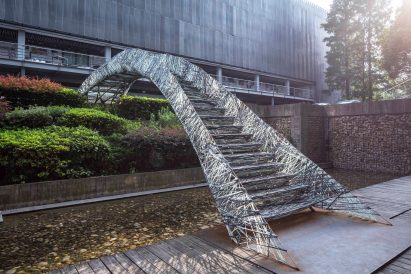 Two robotic fabrication methods entwine to make Tongji University bridge