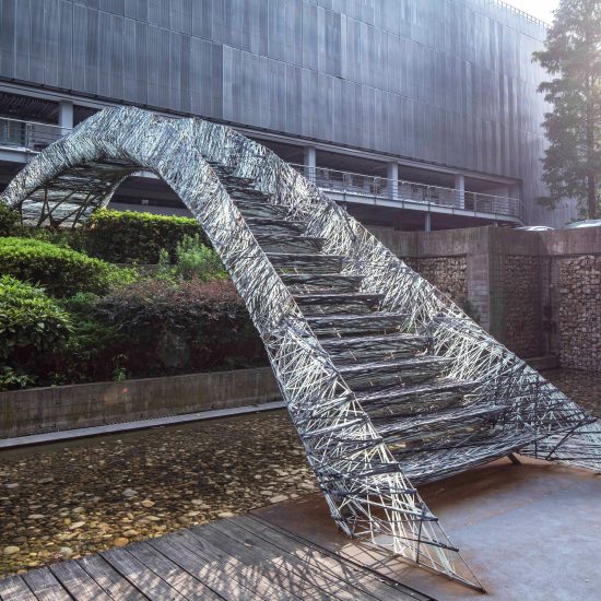 Two robotic fabrication methods entwine to make Tongji University bridge