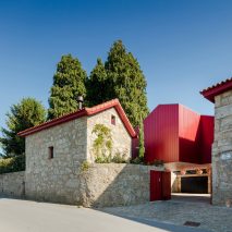 NOARQ renovates stone villa in Portugal with bright red details