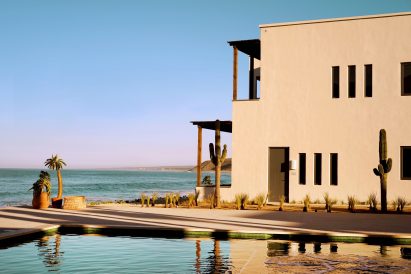 Pale plaster hotel with ocean in background