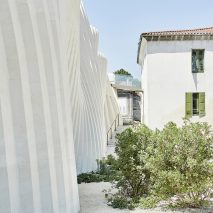 Rippling robot-carved stone facade defines winery by Carl Fredrik Svenstedt Architect