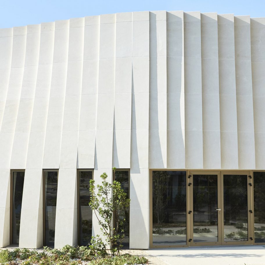 Rippling robot-carved stone facade defines winery by Carl Fredrik Svenstedt Architect