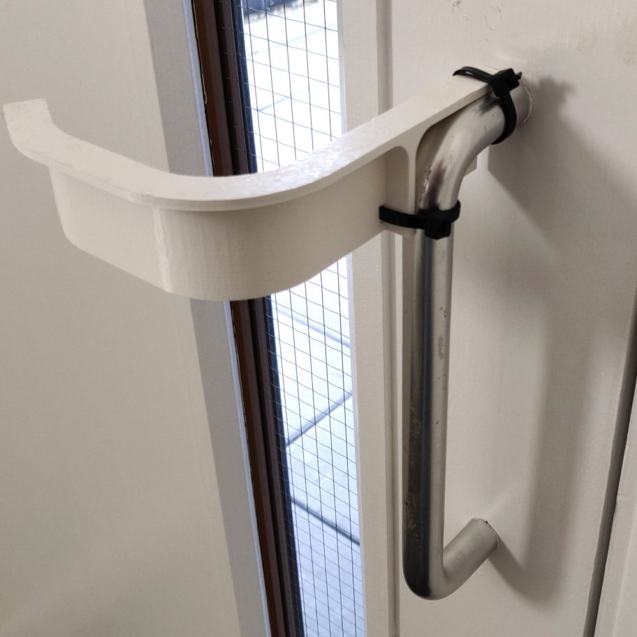 Hands-free door handle adaptor by Ivo Tedbury and Freddie Hong