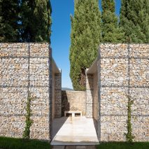 Microscape uses stone-filled cages to update Italian cemetery