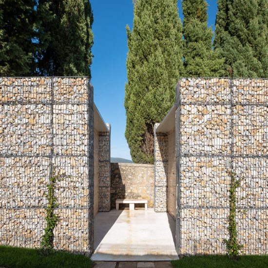 Microscape uses stone-filled cages to update Italian cemetery