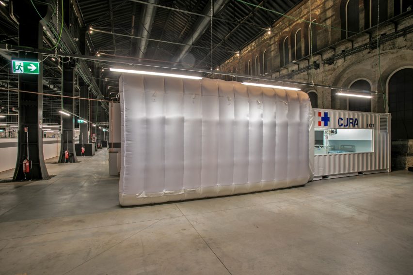 A two-bed intensive care unit within a shipping container, designed by Italian architects Carlo Ratti and Italo Rota, has been built at a hospital in Turin and is being used to treat patients fighting the coronavirus. Named Connected Units for Respiratory Ailments – or CURA, which is the latin word for cure – the intensive care pod was installed to increase intensive care unit (ICU) capacity in northern Italy. Designed by Ratti and Rota to treat two patients requiring intensive care, the unit has been installed at a temporary hospital built within the Officine Grandi Riparazioni complex in central Turin. The first patient was admitted earlier this week on 19 April.   Connected Units for Respiratory Ailments (CURA) intensive care  shipping-container pod by Carlo Ratti and Italo Rota   Built within a 6.1-metre-long shipping container, the intensive care pod contains two beds along with ventilators, monitors, intravenous fluid stands and syringe drivers. According to Ratti the pods combine the benefits of tents with permanent isolation wards as it has a ventilation system that generates negative pressure – a common technique used in hospitals to prevent contaminated air from escaping. The designers say the unit has been designed to comply with Airborne Infection Isolation Rooms (AIIRs) standards. "CURA strives to be as fast to be mounted as a hospital tent, but as safe as a regular isolation ward to work in, thanks to the comprehensive biocontainment equipment," said the designers.   The pod  It is extractor creates indoor negative pressure to comply with the standards of Airborne Infection Isolation Rooms. Two glass windows carved on the opposite sides of the containers are meant for doctors to always get a sense of the status of patients both inside and outside the pods. Also, this would potentially allow external visitors to get closer to their relatives in a safer and more humane setting.   "CURA aims to improve the efficiency of the existing design solutions of field hospitals, producing a compact ICU pod that is quick-to-deploy and safe to work in for medical professionals." The pod in Turin is the first CURA pod to be built, but further units are already under construction in other parts of the world including the UAE and Canada. CURA has been developed as an open-source project, with its tech specs, drawings and design materials made accessible for everyone online on https://curapods.org/open-source-files.   The pods are designed to work as single units, as the one in Turin is set up, or combined to create larger field hospitals.   Photography is by Max Tomasinelli. Project credits: Design and innovation: CRA-Carlo Ratti Associati with Italo Rota Medical engineering: Humanitas Research Hospital Medical consultancy: Policlinico di Milano Master planning, design, construction and logistics support services: Jacobs Research: MIT Senseable City Lab Visual identity & graphic design: Studio FM milano Digital media: Squint/Opera Safety and certifications: IEC Engineering Logistics: Alex Neame of Team Rubicon UK MEP engineering: Ivan Pavanello of Projema Medical consultancy: Maurizio Lanfranco of Ospedale Cottolengo Medical equipment supply: Philips Painting products: Gruppo Boero Support: World Economic Forum Covid-19 Action Platform, and Cities, Infrastructure and Urban Services Platform
