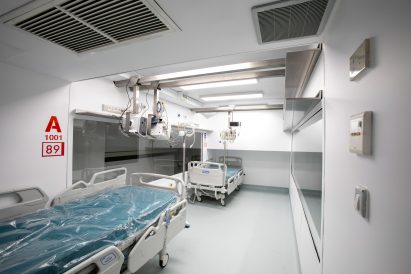 A two-bed intensive care unit within a shipping container, designed by Italian architects Carlo Ratti and Italo Rota, has been built at a hospital in Turin and is being used to treat patients fighting the coronavirus. Named Connected Units for Respiratory Ailments – or CURA, which is the latin word for cure – the intensive care pod was installed to increase intensive care unit (ICU) capacity in northern Italy. Designed by Ratti and Rota to treat two patients requiring intensive care, the unit has been installed at a temporary hospital built within the Officine Grandi Riparazioni complex in central Turin. The first patient was admitted earlier this week on 19 April. Connected Units for Respiratory Ailments (CURA) intensive care shipping-container pod by Carlo Ratti and Italo Rota Built within a 6.1-metre-long shipping container, the intensive care pod contains two beds along with ventilators, monitors, intravenous fluid stands and syringe drivers. According to Ratti the pods combine the benefits of tents with permanent isolation wards as it has a ventilation system that generates negative pressure – a common technique used in hospitals to prevent contaminated air from escaping. The designers say the unit has been designed to comply with Airborne Infection Isolation Rooms (AIIRs) standards. "CURA strives to be as fast to be mounted as a hospital tent, but as safe as a regular isolation ward to work in, thanks to the comprehensive biocontainment equipment," said the designers. The pod It is extractor creates indoor negative pressure to comply with the standards of Airborne Infection Isolation Rooms. Two glass windows carved on the opposite sides of the containers are meant for doctors to always get a sense of the status of patients both inside and outside the pods. Also, this would potentially allow external visitors to get closer to their relatives in a safer and more humane setting. "CURA aims to improve the efficiency of the existing design solutions of field hospitals, producing a compact ICU pod that is quick-to-deploy and safe to work in for medical professionals." The pod in Turin is the first CURA pod to be built, but further units are already under construction in other parts of the world including the UAE and Canada. CURA has been developed as an open-source project, with its tech specs, drawings and design materials made accessible for everyone online on https://curapods.org/open-source-files. The pods are designed to work as single units, as the one in Turin is set up, or combined to create larger field hospitals. Photography is by Max Tomasinelli. Project credits: Design and innovation: CRA-Carlo Ratti Associati with Italo Rota Medical engineering: Humanitas Research Hospital Medical consultancy: Policlinico di Milano Master planning, design, construction and logistics support services: Jacobs Research: MIT Senseable City Lab Visual identity & graphic design: Studio FM milano Digital media: Squint/Opera Safety and certifications: IEC Engineering Logistics: Alex Neame of Team Rubicon UK MEP engineering: Ivan Pavanello of Projema Medical consultancy: Maurizio Lanfranco of Ospedale Cottolengo Medical equipment supply: Philips Painting products: Gruppo Boero Support: World Economic Forum Covid-19 Action Platform, and Cities, Infrastructure and Urban Services Platform