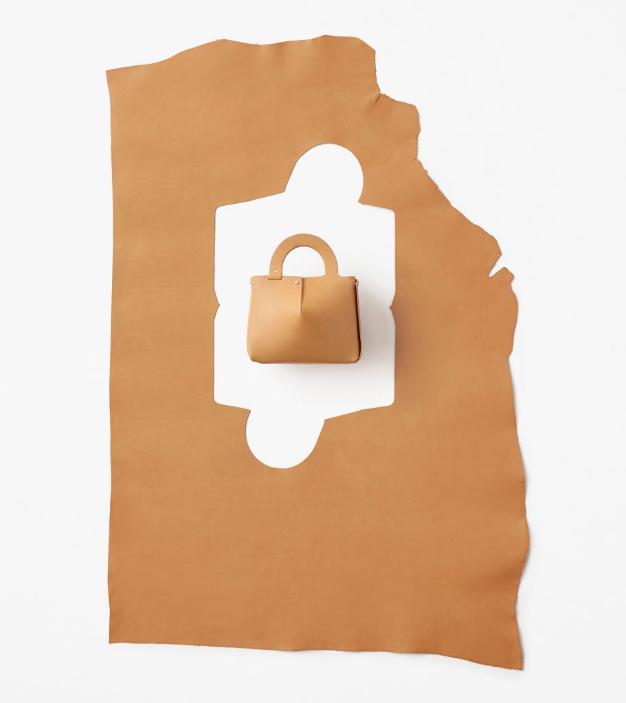 Nendo designs Mai bag from single sheet of laser-cut leather