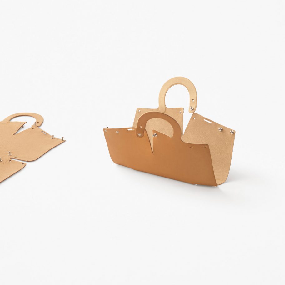 Nendo designs Mai bag from single sheet of laser-cut leather