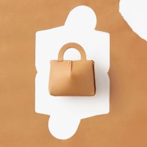 Nendo designs Mai bag from single sheet of laser-cut leather