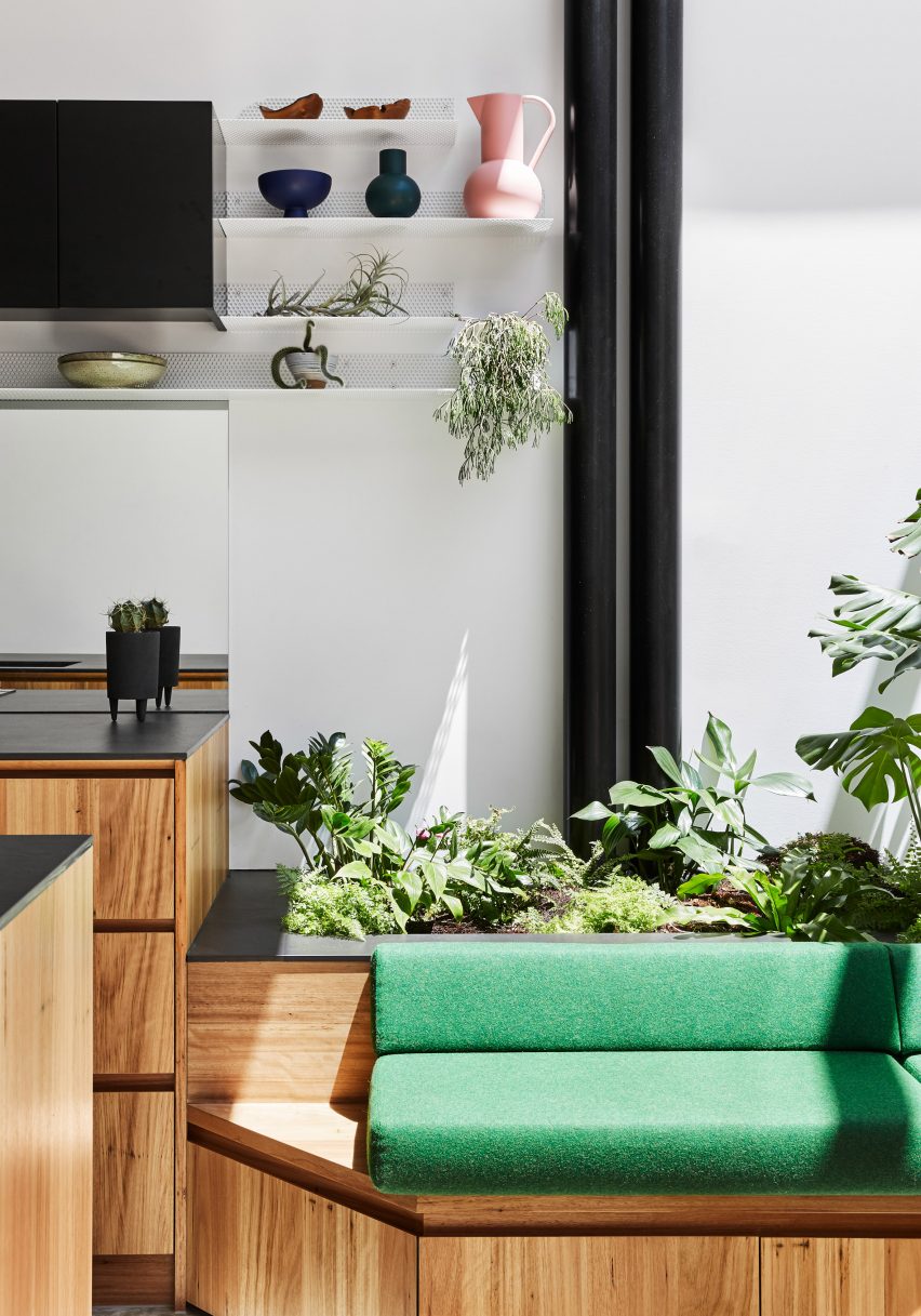 Green bench seat in the dining space