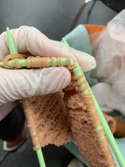 Rie Sakamoto knits rubber bands together like yarn for elastic garments
