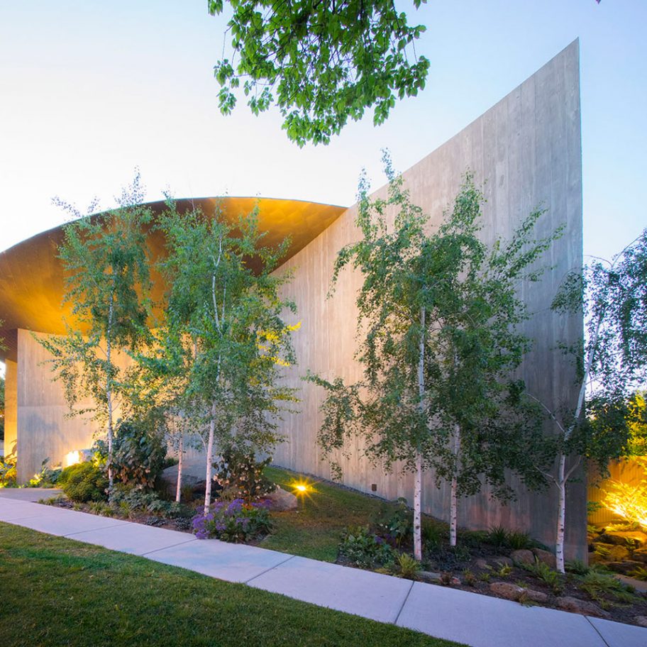 Wood Marsh tops curving concrete walls with zinc disc for house in Melbourne