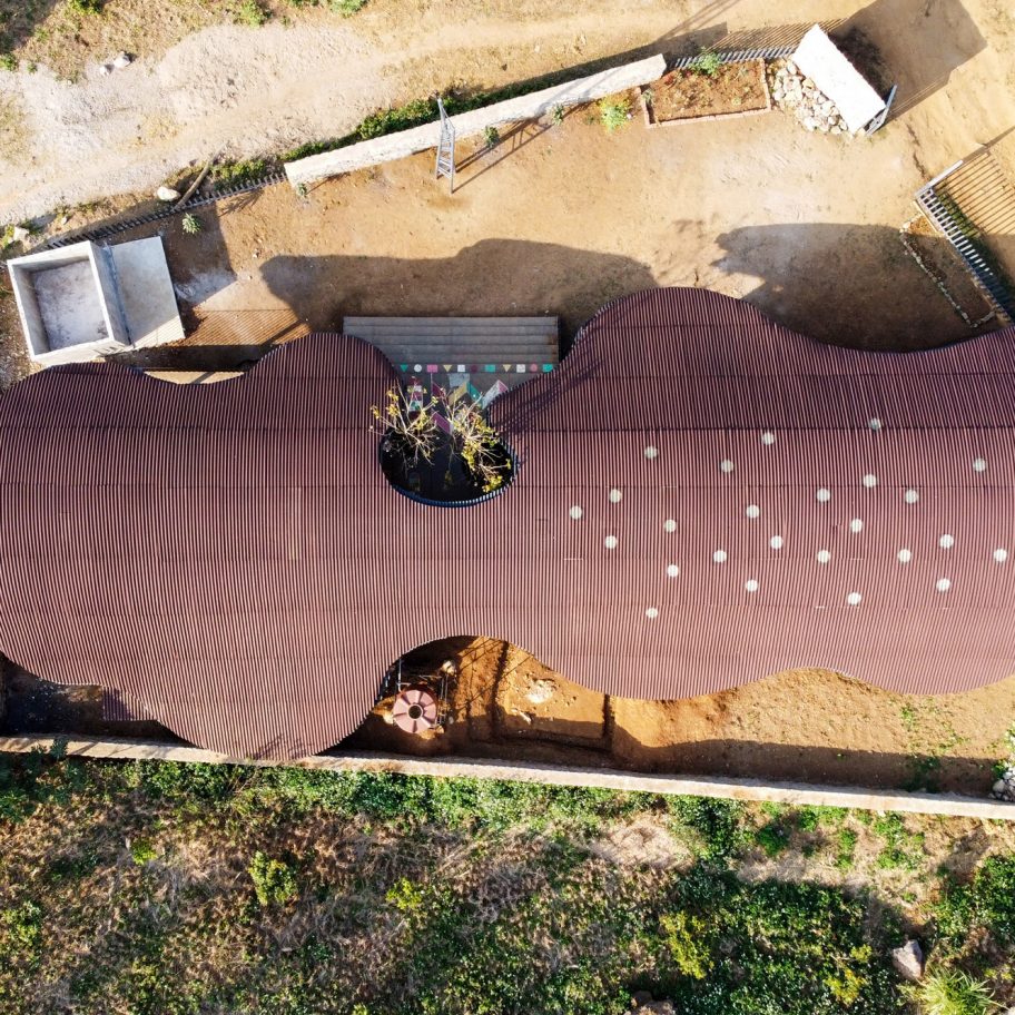 Undulating roof shades Bó Mon preschool by Kientruc O in rural Vietnam