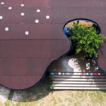 Undulating roof shades Bó Mon preschool by Kientruc O in rural Vietnam