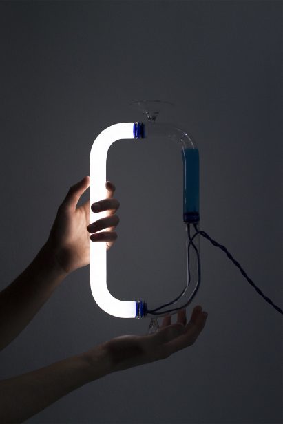 Tubular Circuiti Liquidi lamp uses blue liquid to activate light
