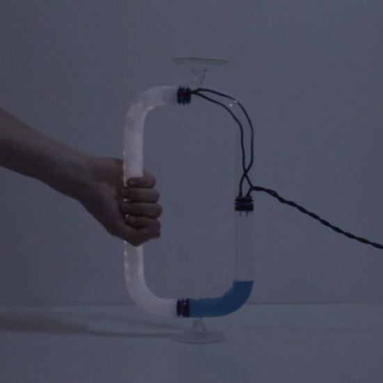 Tubular Circuiti Liquidi lamp uses blue liquid to turn on light