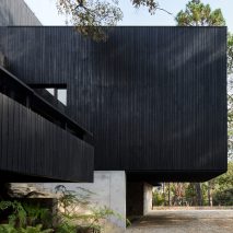 Charred wood and stone create dark house Casa Di-Dox by Magaldi Studio