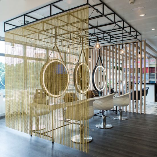 Kriskadecor's chain-link partitions aid social distancing in shared interiors