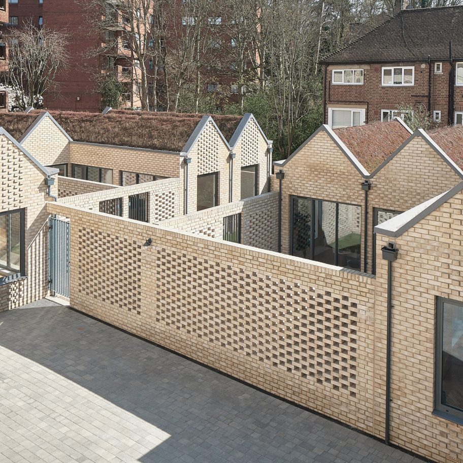 KennedyTwaddle inserts pitched-roofed houses with private courtyards into former timber yard