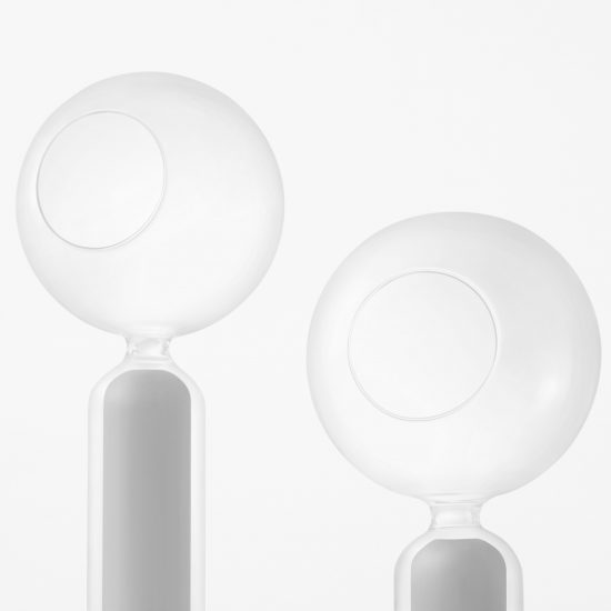 Nendo designs space helmet-shaped vessels and cascading tables for Zens