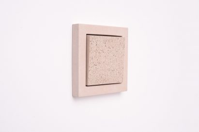 Sekhina designs minimal light switches and sockets from concrete