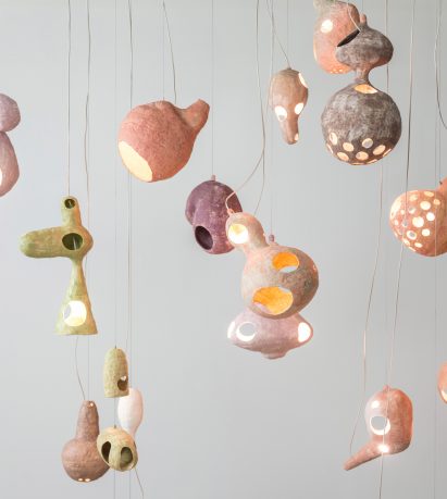 Yuko Nishikawa forms "floating" amorphous lights from shells of clay and paper