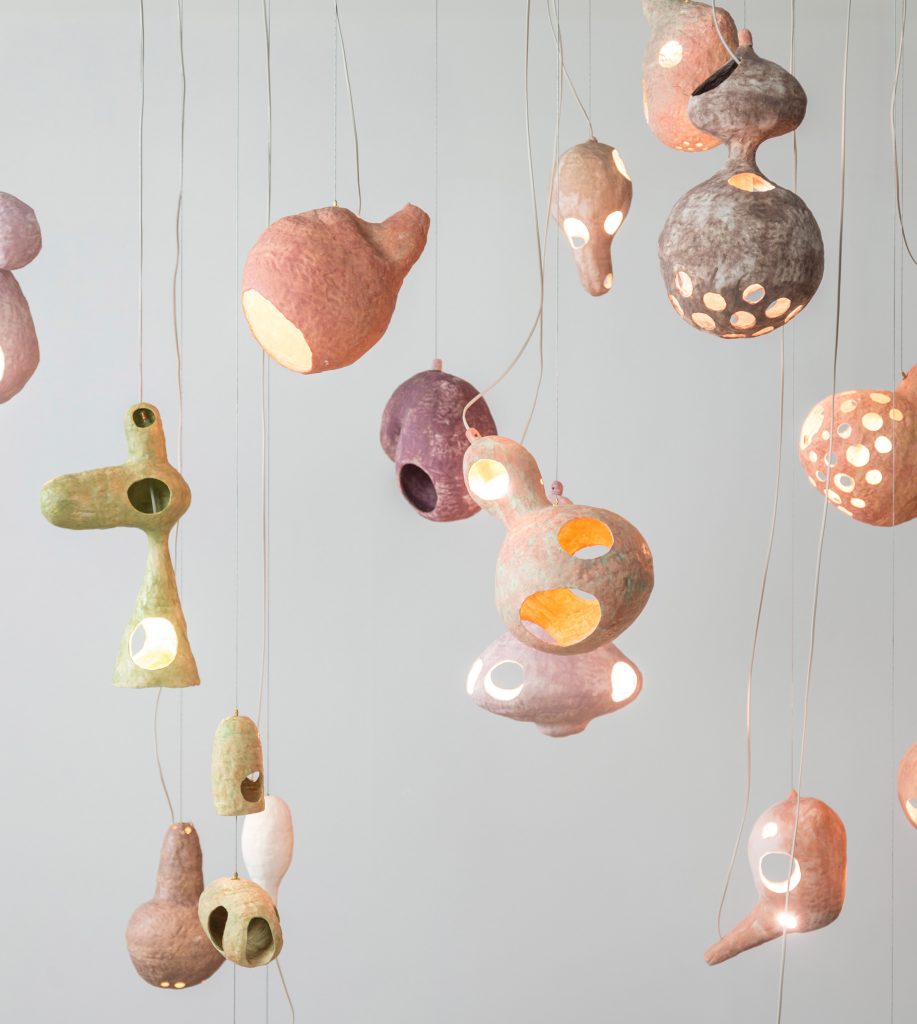 Yuko Nishikawa forms "floating" amorphous lights from shells of clay and paper