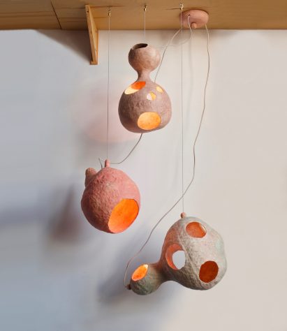 Yuko Nishikawa forms "floating" amorphous lights from shells of clay and paper