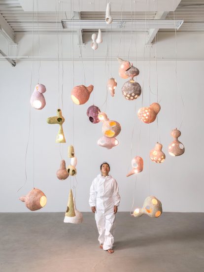 Yuko Nishikawa forms "floating" amorphous lights from shells of clay and paper