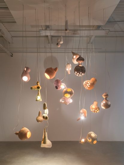 Yuko Nishikawa forms "floating" amorphous lights from shells of clay and paper