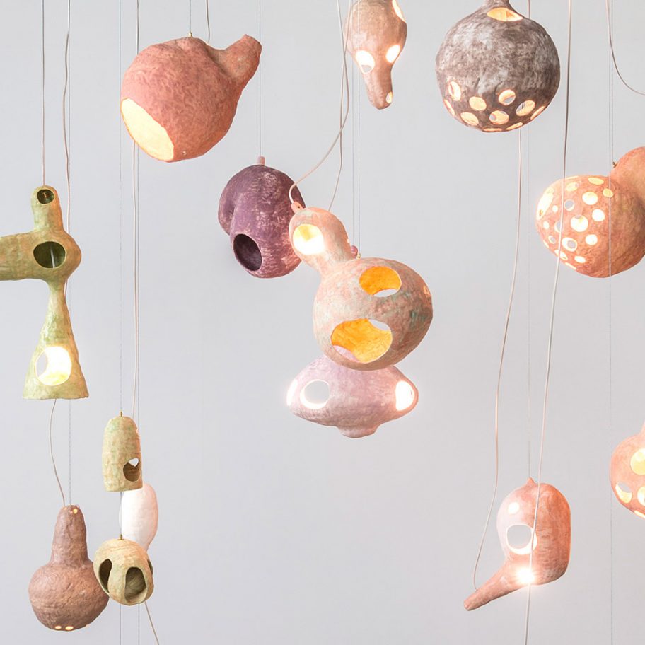 Yuko Nishikawa forms "floating" amorphous lights from shells of clay and paper