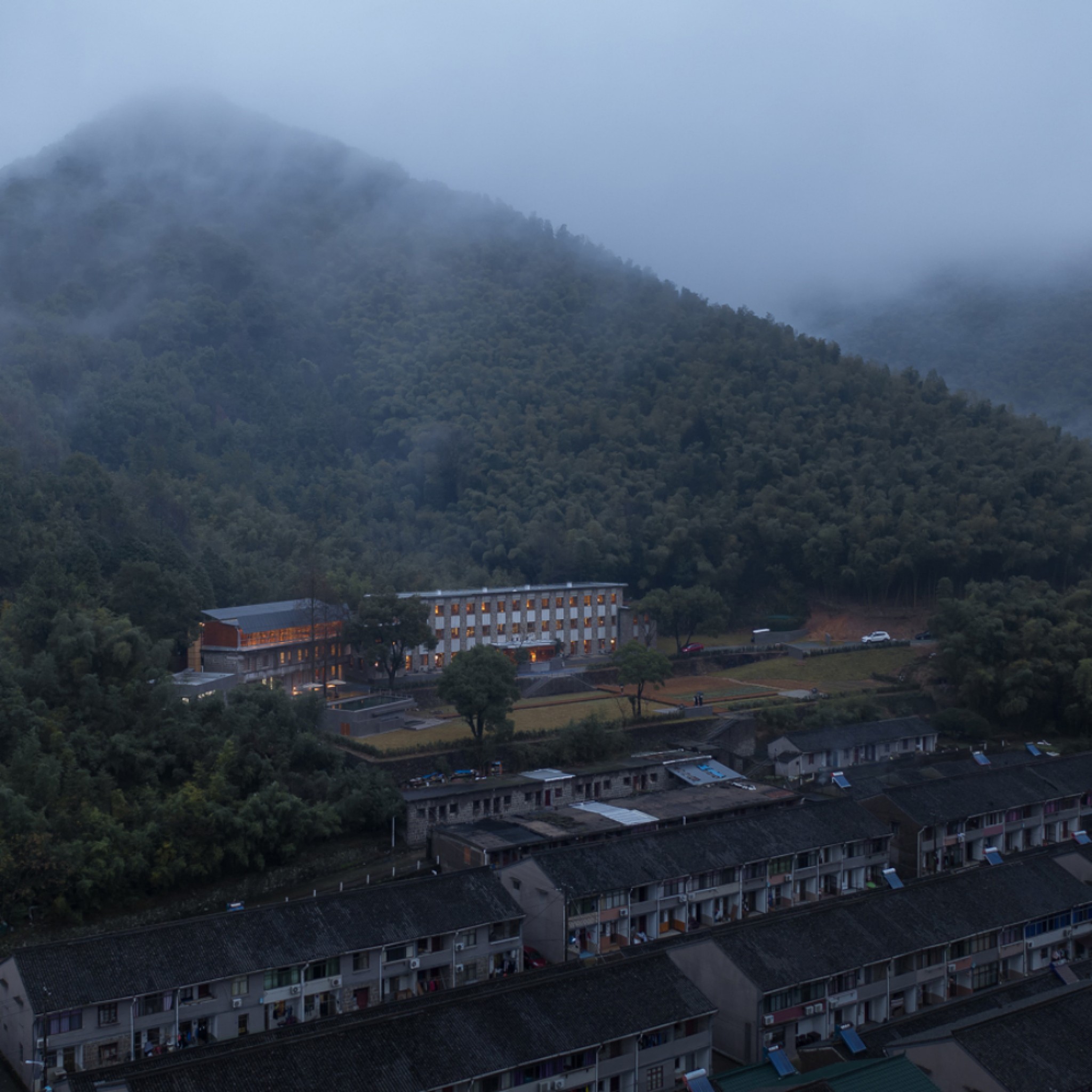 Lostvilla Qinyong Primary School Hotel by Atelier XÜK