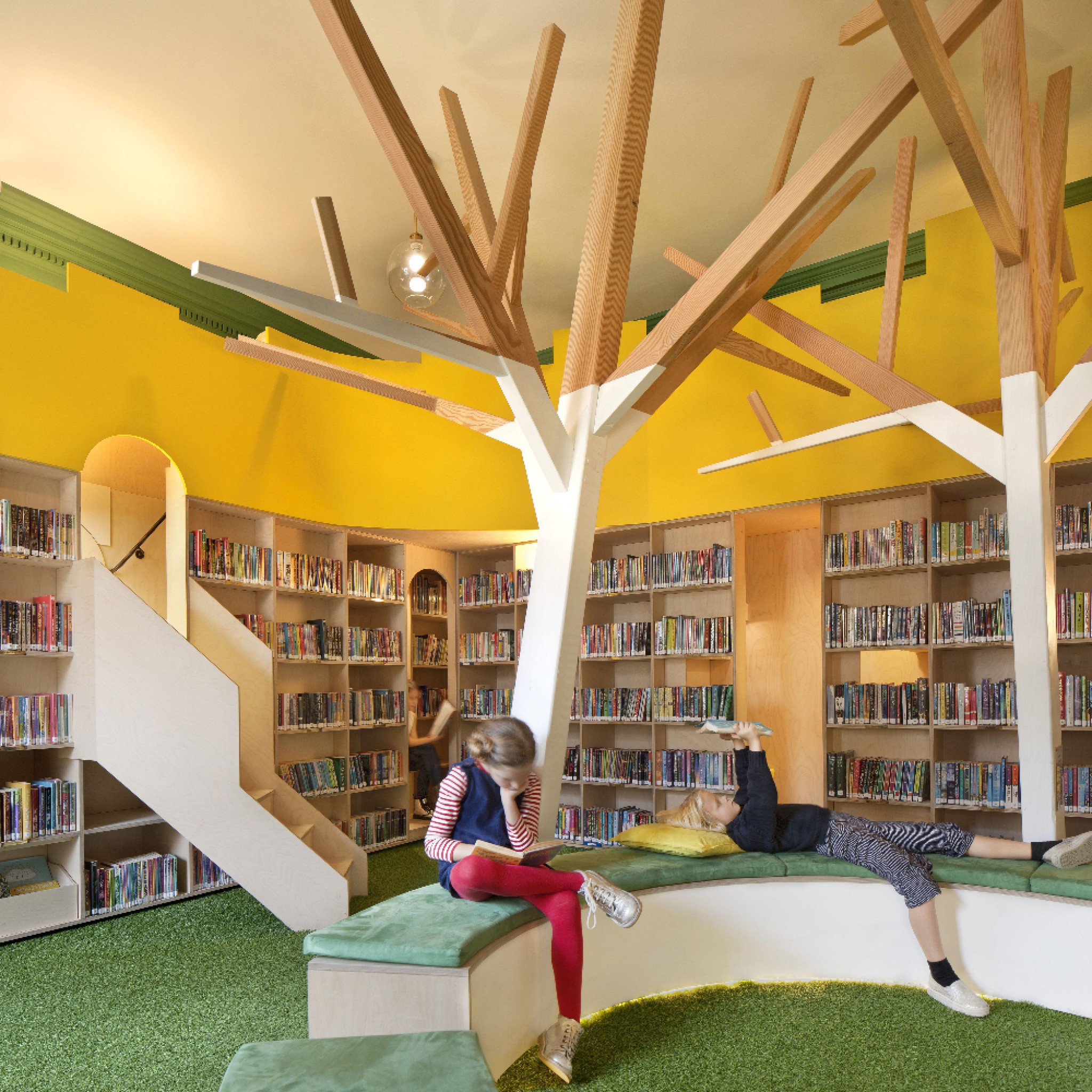 John Ramplin Room - full-height plywood walls of shelves evoke the grand libraries of the past, with a markedly playful and modern twist