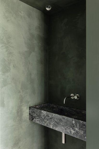 Green bathroom features in Belgium apartment