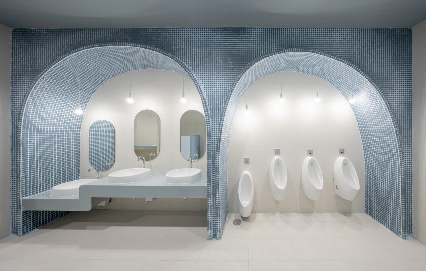 Arched blue tiled bathroom in children's hospital designed by Integrated Field
