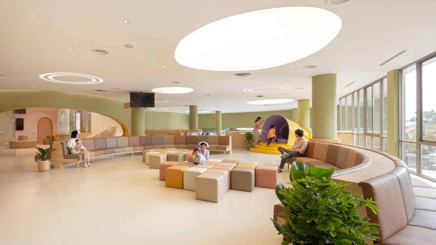 pharmacy with soft play area in children's hospital by Integrated Field