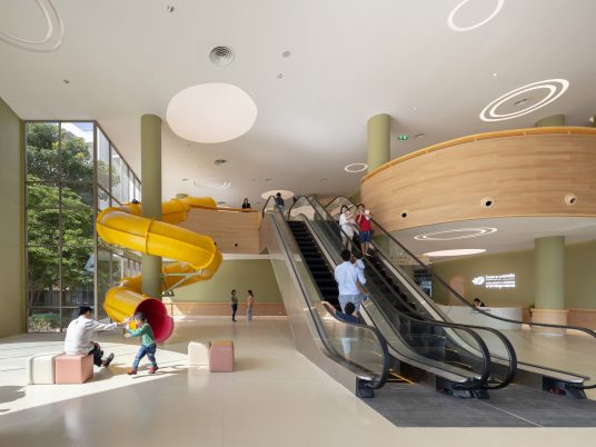 Yllow spiral slide in waiting room of children's hospital
