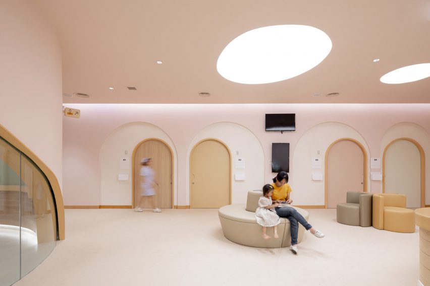 Arches and curved seating in children's hospital by Integrated Field