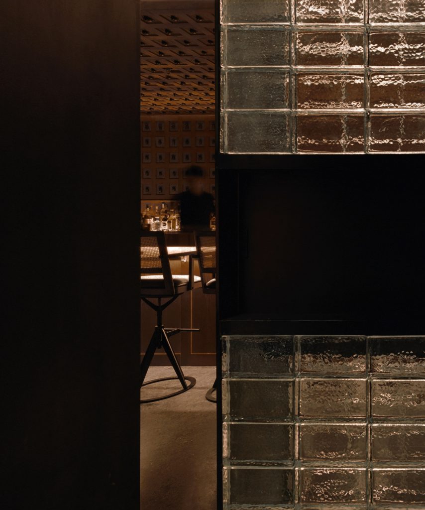 Glass wall contains preserved spiders in J Boroski bar in Shanghai by Atelier XY