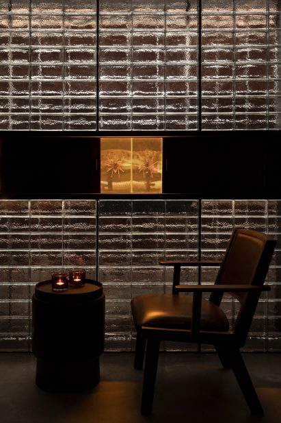 Glass wall contains preserved spiders in J Boroski bar in Shanghai by Atelier XY