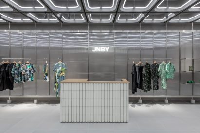 Interiors of JNBY store in Xiamen, China feature concrete, steel and glass