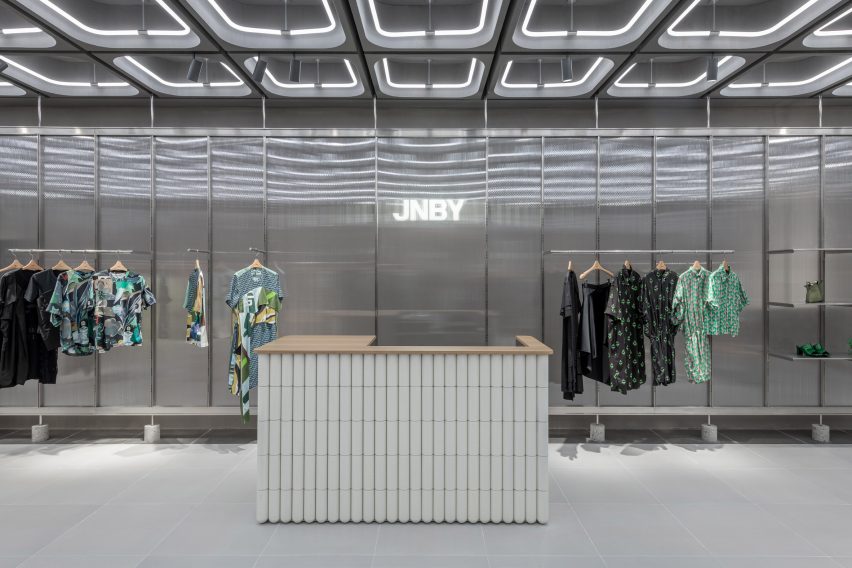 Interiors of JNBY store in Xiamen, China feature concrete, steel and glass