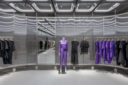 Interiors of JNBY store in Xiamen, China feature concrete, steel and glass