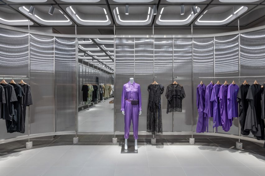 Interiors of JNBY store in Xiamen, China feature concrete, steel and glass