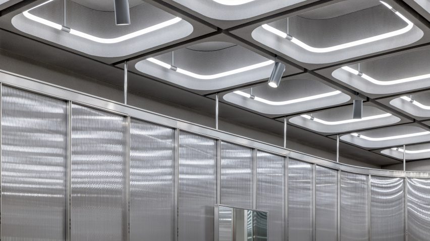 Interiors of JNBY store in Xiamen, China feature concrete, steel and glass