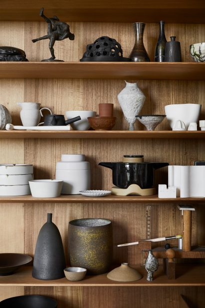 Shelf of ceramics in Kew Residence by John Wardle Architects in Melbourne, Australia