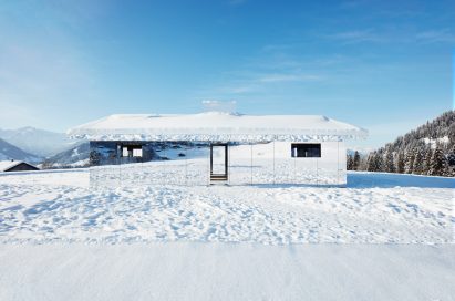 Mirage Gstaad mirrored building art installation by Doug Aitken in Switzerland in winter