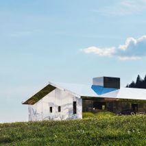 Mirage Gstaad mirrored building art installation by Doug Aitken in Switzerland in summer