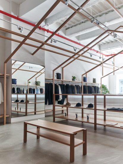 Gabled structures in Nanamica store by Taichi Kuma